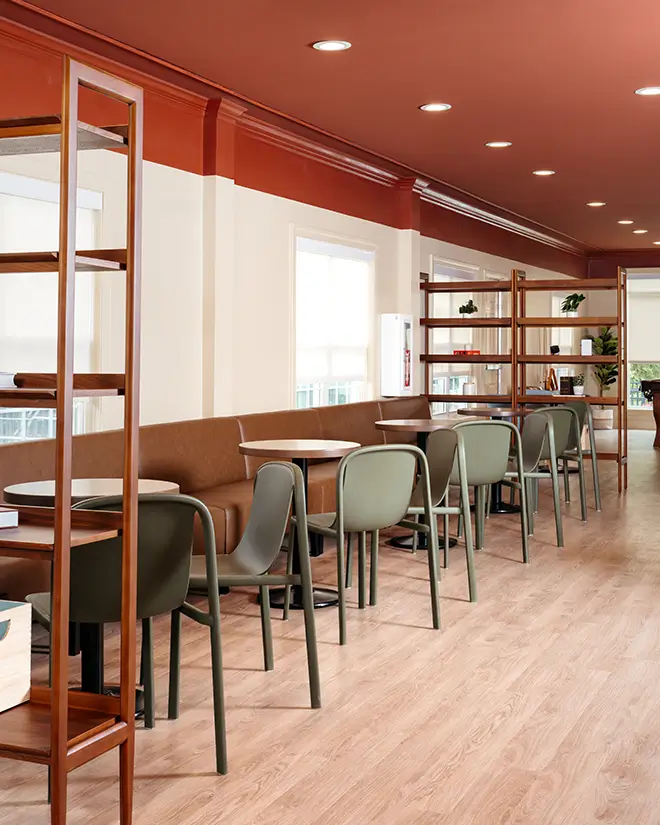 Study lounge with café tables and wood shelving