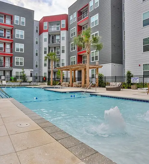 The Rive Columbia courtyard pool with fountains and lounge chairs